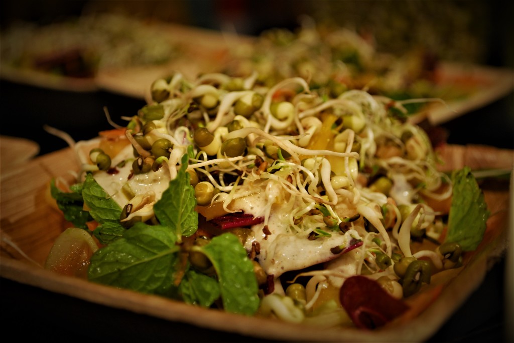 Vegan cookery workshop salad in a bowl with dressing and sprouts